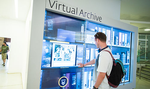 Male student using virtual archive screen