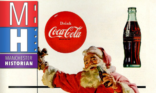 Father Christmas brandishing a bottle of Coca Cola