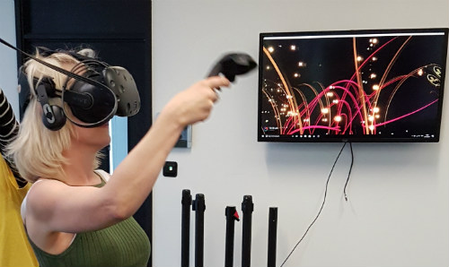 A female participant using a virtual reality headset