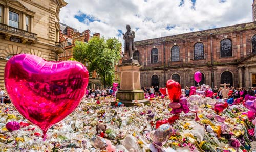 Photograph of the tributes in St Ann's Square to the dead and injured following the Manchester Arena attack in May 2017.  Photograph courtesy of Manchester City Council.