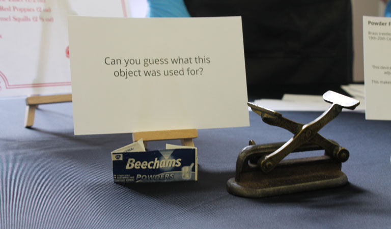A mysterious medical object with a question card asking visitors to guess what it was used for.