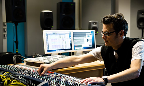 Man at music studio desk