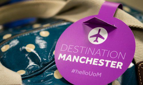 Bag label that says destination Manchester