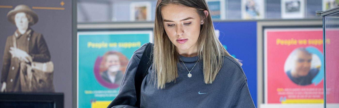 A female student stood in an art gallery