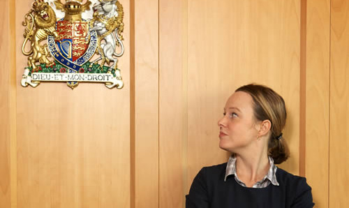 Female looking up at court logo