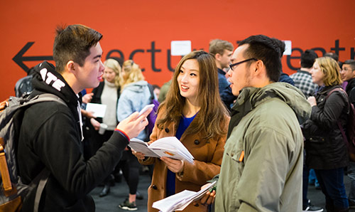 Group of students talking to each other