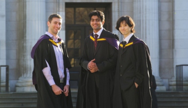 Three male graduates smiling