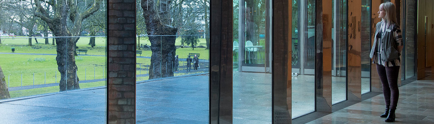 Girl in the Whitworth extension looking out of the window