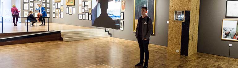 Male student in an exhibition at Whitworth Art Gallery