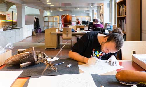 Archaeology student at desk