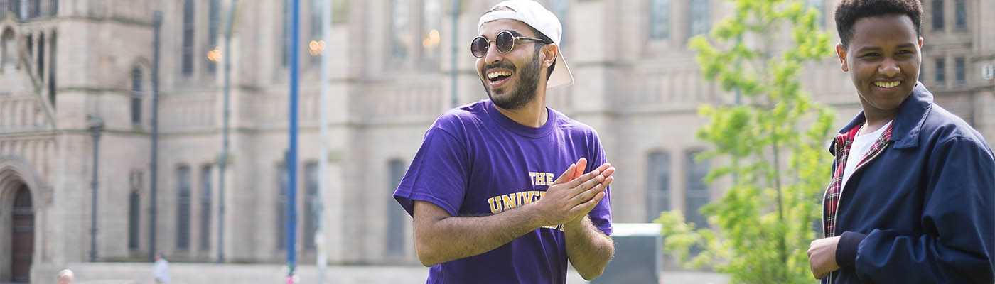 Student ambassadors laughing on campus