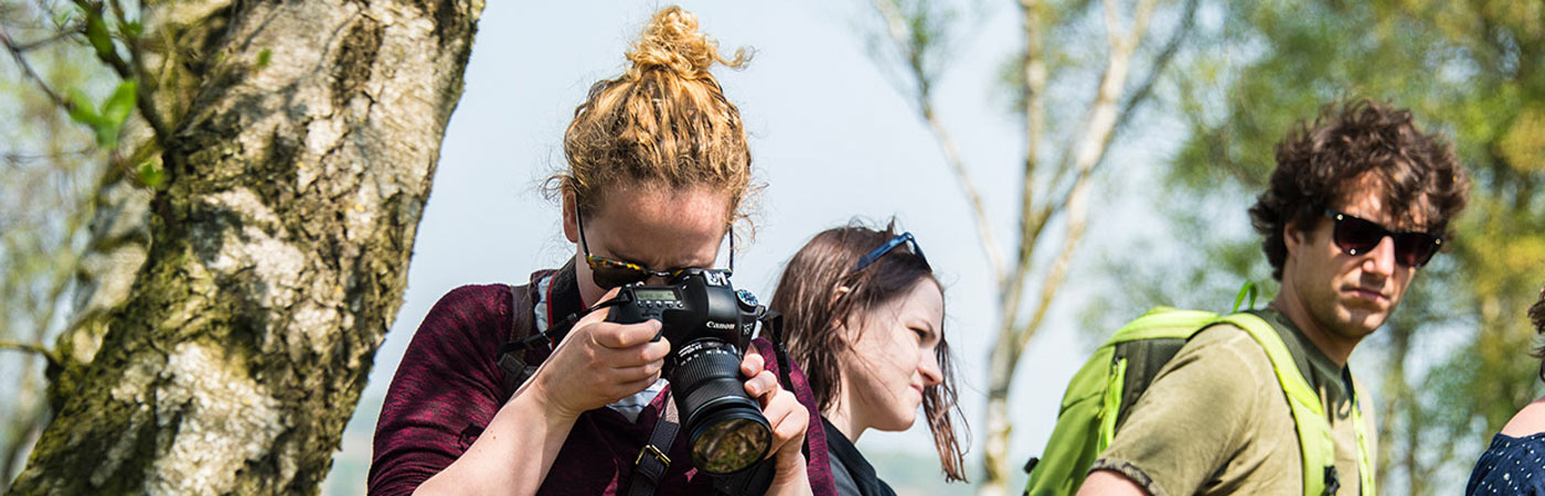 Female taking photo with professional camera