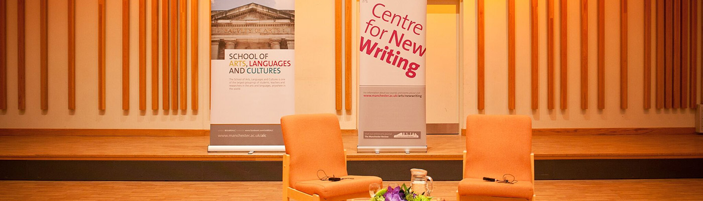 Two chairs in hall with school banner in the background