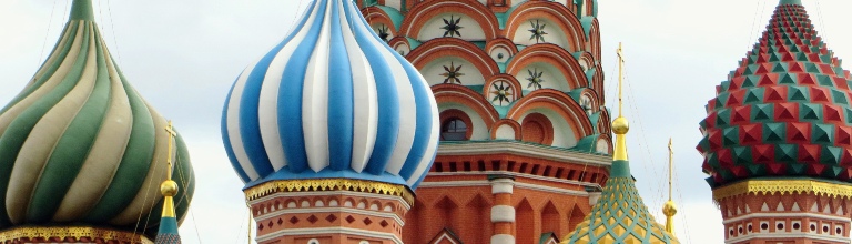 St Basil's cathedral in Moscow - close up of the onion-shaped roof domes in red, blue, white green and gold. 