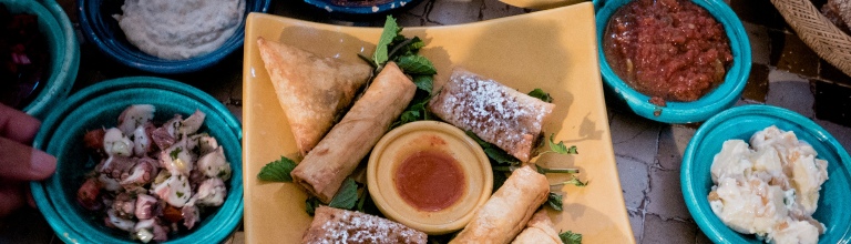 Selection of Middle Eastern meze dishes in small bowls  