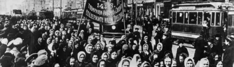 Black and white photo of women marching in Petrograd 1917. 