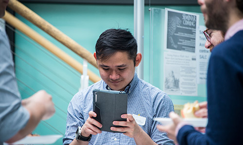 Man looking at tablet