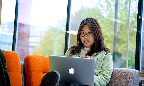 Woman sat working on laptop