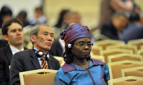 Conference delegates listening to interpretation through a headset