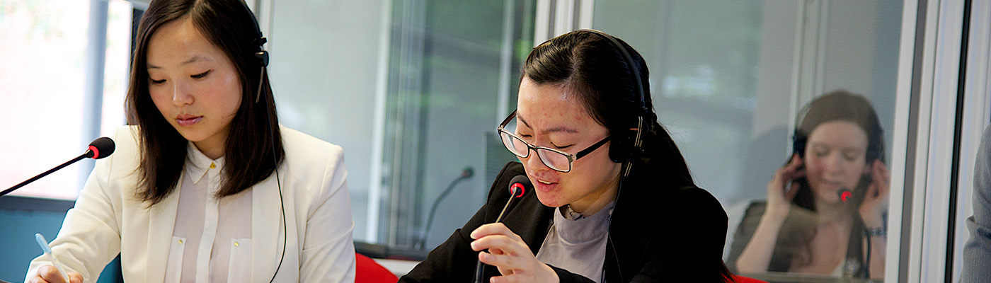 Two students in an audio booth 