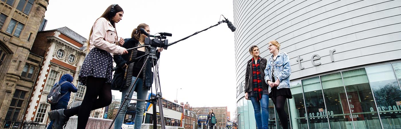 Students filming outside university 