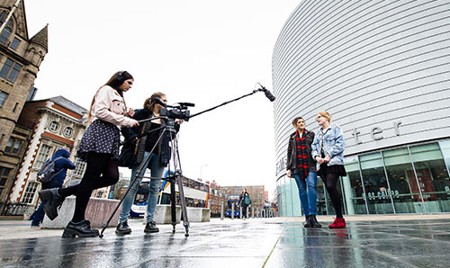 Students filming outside the University