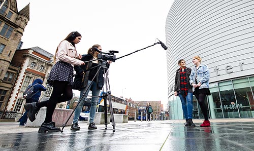 Students filming outside university