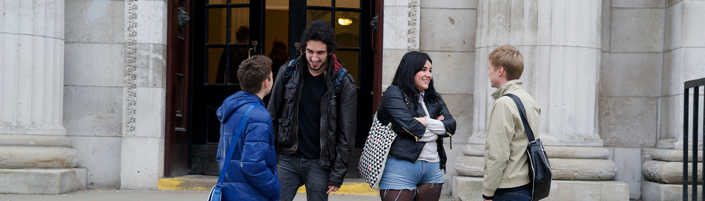 Students chatting outside Samuel Alexander