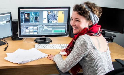 Two students in media editing suite.