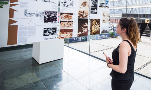 Postgraduate student looking at an exhibit in a muesuem