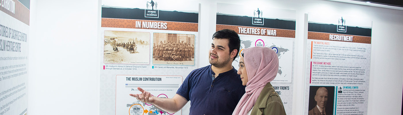 Students looking at display in history exhibit