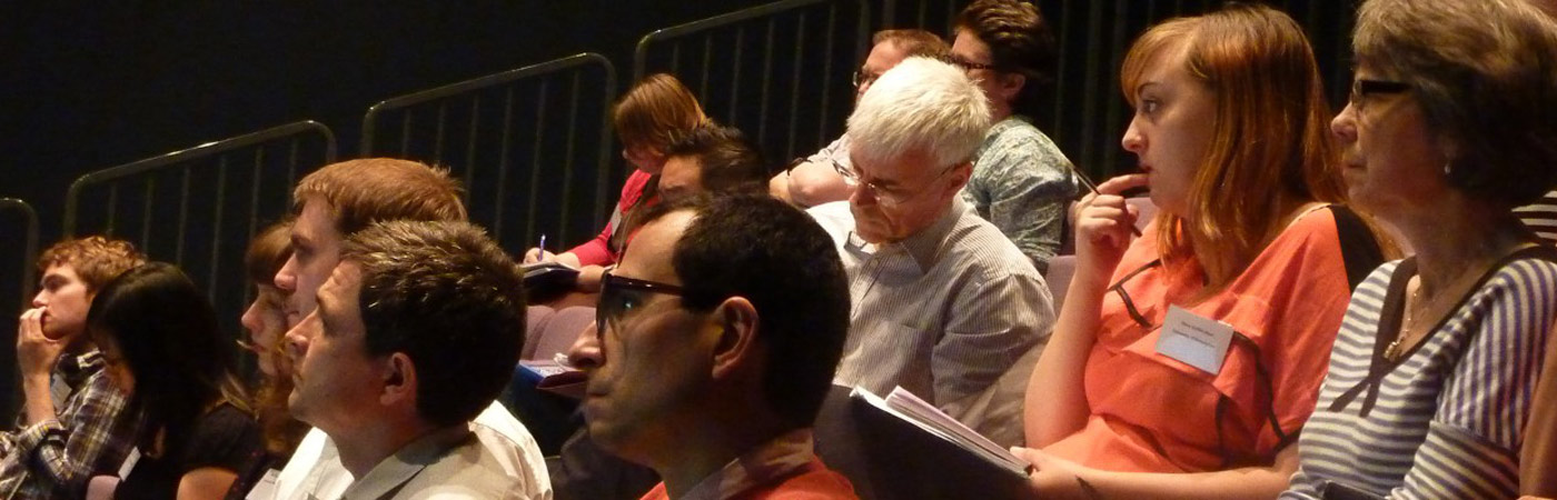 audience members listening to lecture