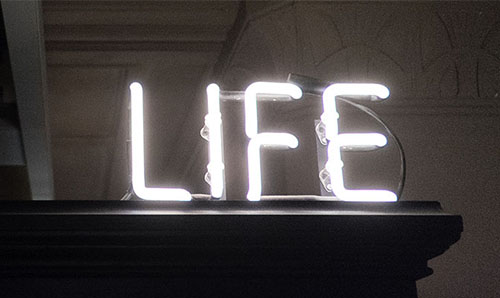 Neon Life sign inside the Manchester Museum