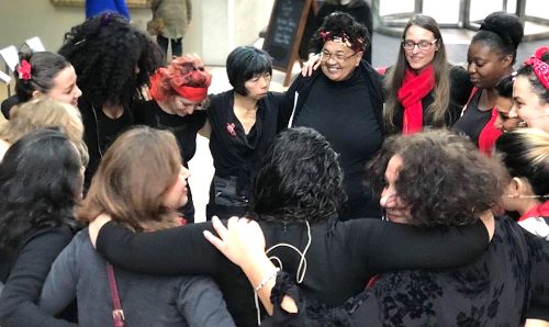 A group of women gathered in a circle