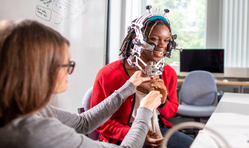 Researchers using equipment in the Language and Linguistics lab