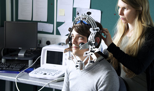 Researchers using equipment in the Language and Linguistics lab