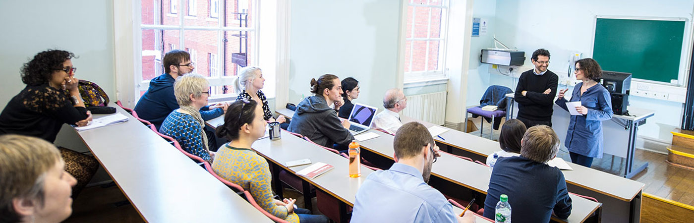 Two tutors giving a lecture