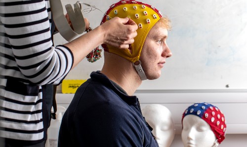 Researchers using equipment in the Language and Linguistics lab