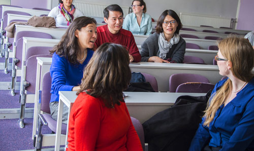 PhD students in a seminar room