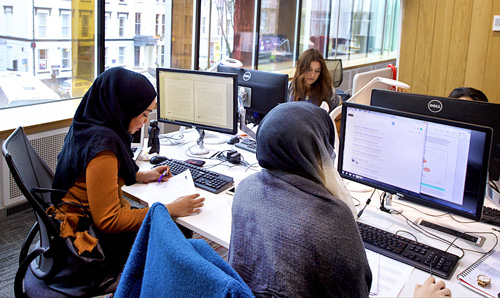 Researchers working in the library at Manchester