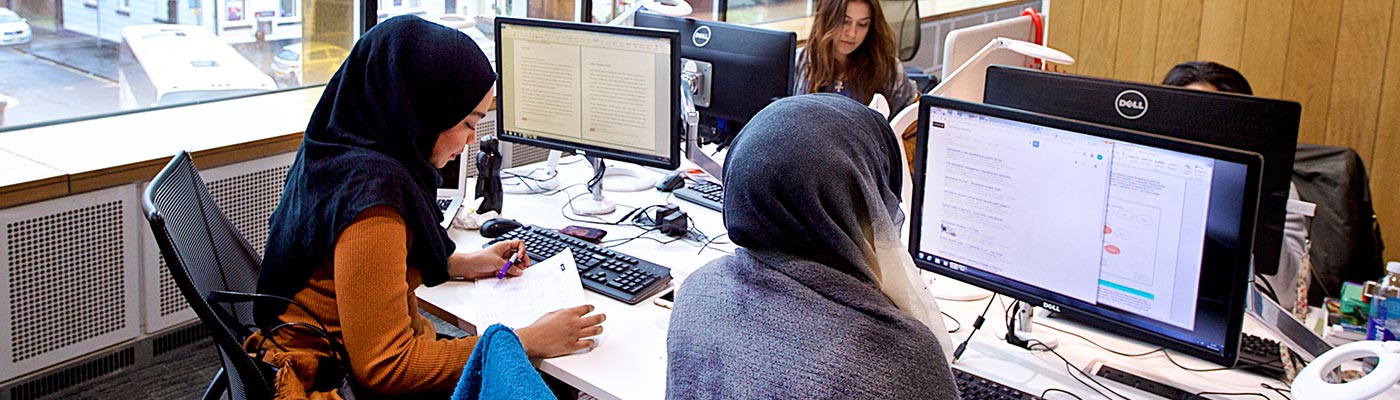 Two female students working on computer