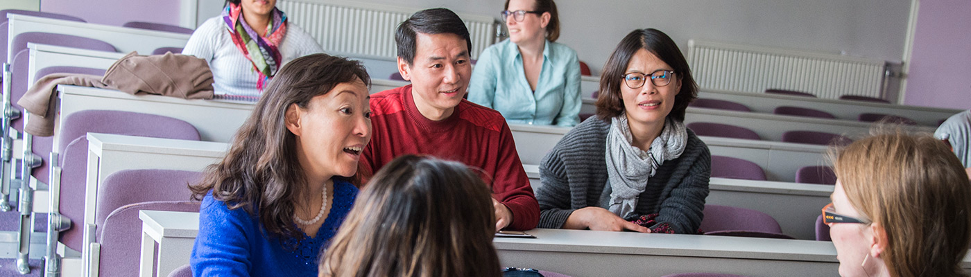 Older students talking in classroom