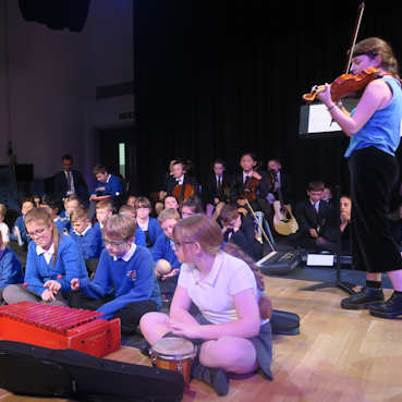 School children playing instruments