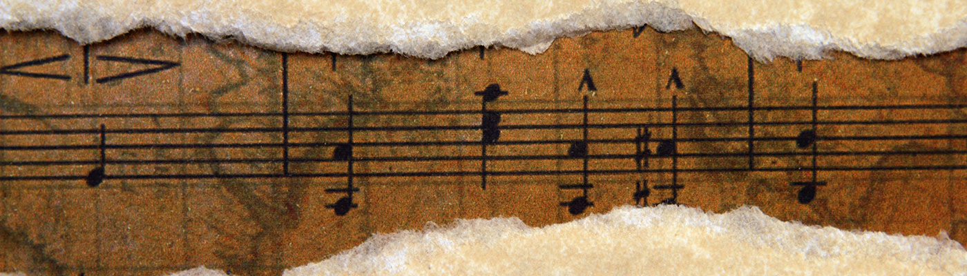Old music script on torn paper