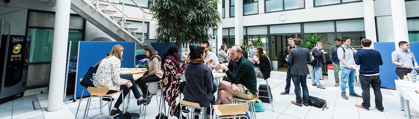 Students in the Graduate School, Ellen Wilkinson Building atrium