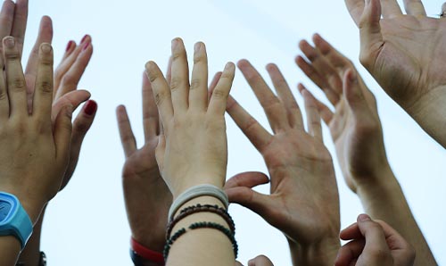 Hands raised in hope