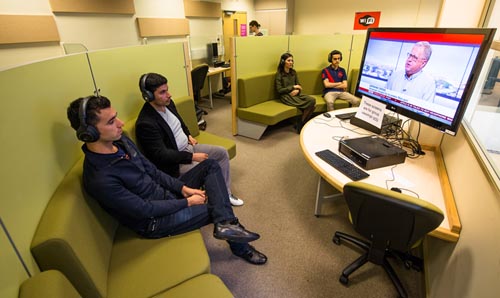 students in viewing booths