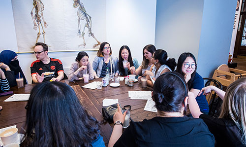 Group of people sat around a table