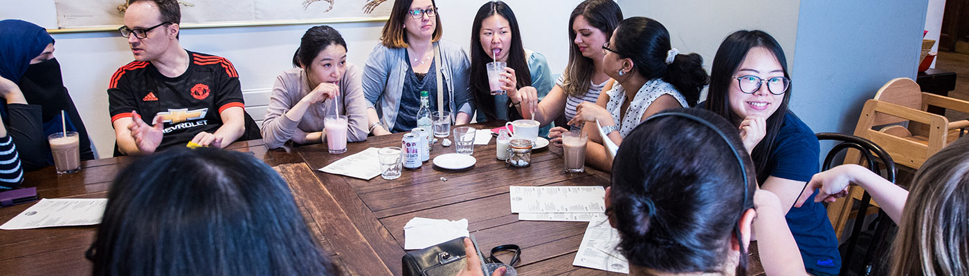 Group of people sat around a table