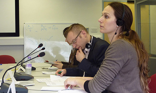 Female with headphones on looking to one side